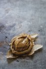 Yummy apple mini galette on parchment on grey background — Stock Photo