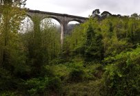 Majestic high viaduct under cloudy sky — Stock Photo