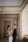 Married couple dancing inside luxury building — Stock Photo