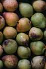 Fresh organic ripe pears in layer — Stock Photo