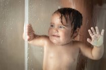 Cheerful mother with baby taking shower — Stock Photo