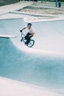 Man riding bicycle on springboard — Stock Photo
