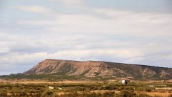 Magnificent view of rocky hills under cloudy sky of Bardenas Reales in Navarre, Spain — Stock Photo