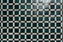 Vintage handmade checkered tile ceramic — Stock Photo