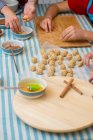 Working on traditional pastry painted with egg before baking — Stock Photo