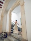 Bride posing on steps for camera — Stock Photo