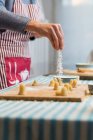 Working with dough of traditional catalonian pastry — Stock Photo