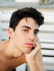 Brunette shirtless young guy looking at camera — Stock Photo