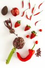 Mix of fruits and vegetables in red color on white background. Healthy food Detox Flat lay. From above — Stock Photo
