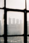 View of city through dirty window — Stock Photo