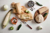 Dough near corn husk and spices for tamales — Stock Photo