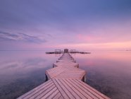 Wooden pier on cloudy evening — Stock Photo