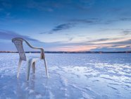 Chair on salt mine during sunset — Stock Photo