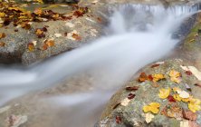 Closeup of waterfall splashing between rocks — Stock Photo