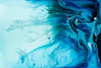 Abstract flow of liquid paints in mix — Stock Photo