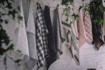 Dish cloths hanging on twist with pins — Stock Photo
