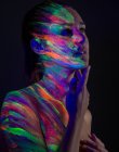 Topless model in neon lights — Stock Photo