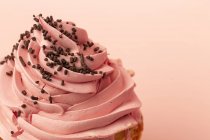 Close-up of delicious homemade cupcake on pink background — Stock Photo