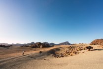 Silhouette of person on sand land near mountain Teide and picturesque view of blue heaven in Tenerife, Canary Islands, Spain — Stock Photo