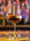 Glass with chocolate alcohol cocktail on blurred background — Stock Photo