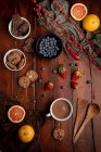 Fresh hot beverage and various tasty breakfast food placed on lumber tabletop in morning — Stock Photo