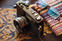 Closeup of vintage camera on decorative table — Stock Photo