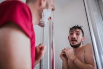 Playful gay couple having fun in bathroom together — Stock Photo