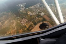 Aerial view from inside cockpit of a small plane — Stock Photo