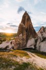 Rough stone formations located in valley on sunny day in Cappadocia, Turkey — Stock Photo