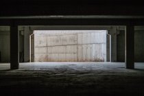Inside abandoned concrete building with columns — Stock Photo
