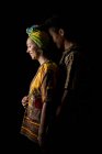 Happy young attractive African couple in bright ethnic clothes — Stock Photo