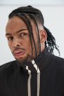 Portrait of African American man with braids on white background — Stock Photo