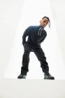 African American man in black clothes with braided hair posing on white background — Stock Photo