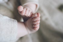 Charming cute baby feet and fingers of new born — Stock Photo