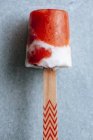 Closeup of watermelon and cream popsicle on grey background — Stock Photo