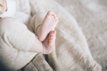 Charming cute baby feet and fingers of new born — Stock Photo