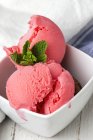 Appetizing strawberry ice cream in white bowl — Stock Photo
