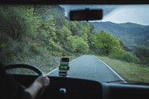 View from inside car of empty road of rural area in overcast weather — Stock Photo