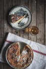 From above cottage cheese baked pudding served on vintage plate and towel against wooden table — Stock Photo