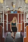 Young blonde woman posing in train car in Berlin — Photo de stock