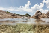 Picturesque view of rocky island and sea bottom on sunny summer day in Halkidiki, Greece — Stock Photo