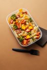 Lunchbox with pasta and plastic fork — Stock Photo