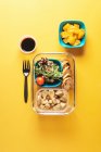Plastic containers with healthy food and black fork — Stock Photo
