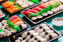 Appetizing delicious set of colorful sushi served on table in restaurant. — Stock Photo