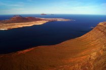Breathtaking landscape of great wonderful islands in dark calm water in Lanzarote Canary islands, Spain — Stock Photo