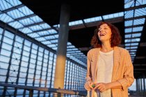Smiling attractive young woman at station — Stock Photo