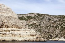 Beautiful white limestone rocks on seashore — Stock Photo