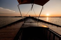 Front of boat riding along sea at twilight — Stock Photo