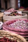Wicker baskets with dried herbs placed on market on street of Marrakesh, Morocco — Stock Photo