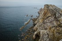 Majestic cliffs of ocean coastline in sunlight — Stock Photo
